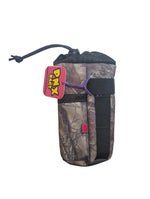 Camo-patterned pouch with 'PNX' tag on a white card, surrounded by various items on a table.